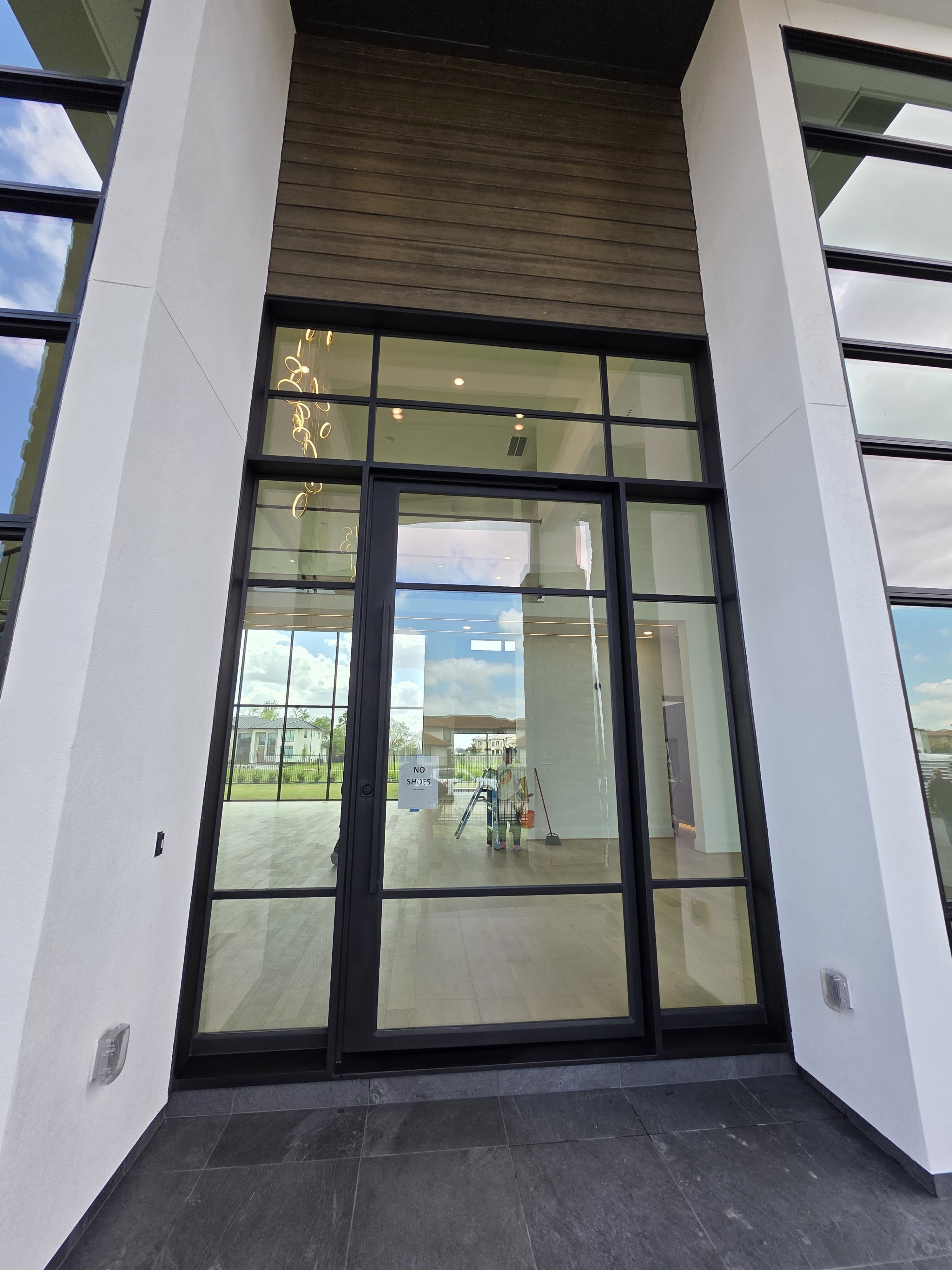 Tall iron entry with sidelights and transoms